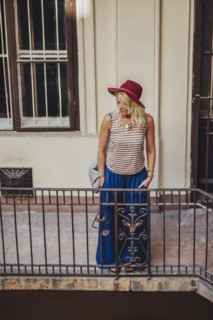 Caucasian woman standing on balcony