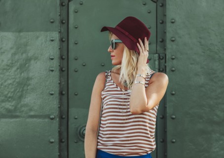 Caucasian woman in hat and sunglasses