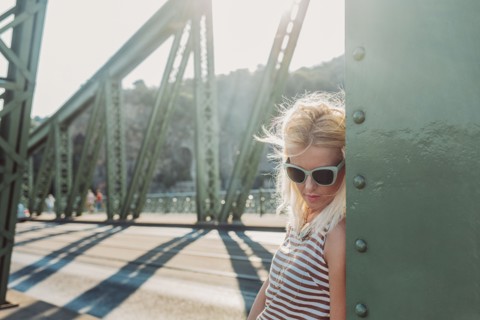 Caucasian woman standing on bridge