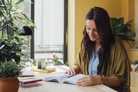Caucasian woman studying at desk