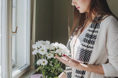 Woman arranging flowers