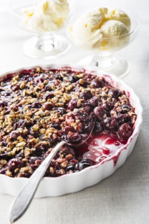 Spoon in cherry crisp