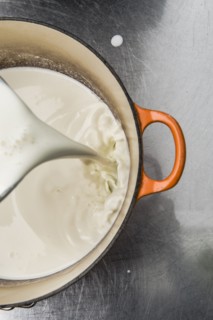 Milk pouring into pot