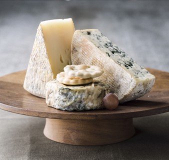 Wedges of cheese on tray