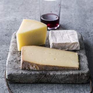 Wedges of cheese and red wine