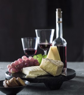 Cheese and grapes with red wine