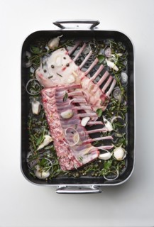 Raw racks of lamb in pan