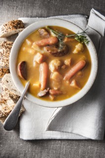 Bowl of stew with bread and napkin
