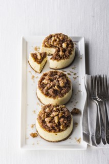 Miniature cheesecakes on tray with forks