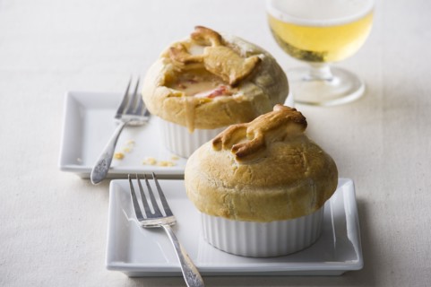 Pot pies with forks on plates