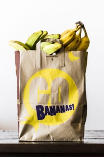 Brown paper bag of bananas