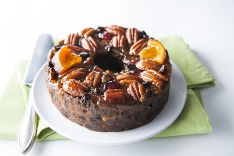 Fruit cake with pecans on plate