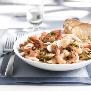 Plate of shrimp and pasta with bread