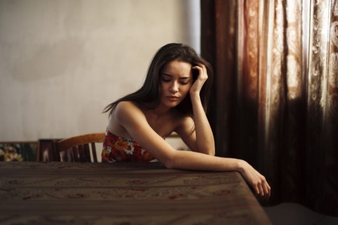 Caucasian woman sitting at table