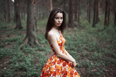 Caucasian woman standing in forest