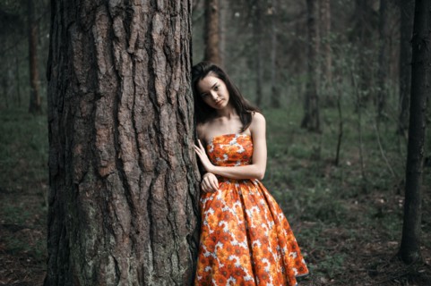 Caucasian woman standing in forest