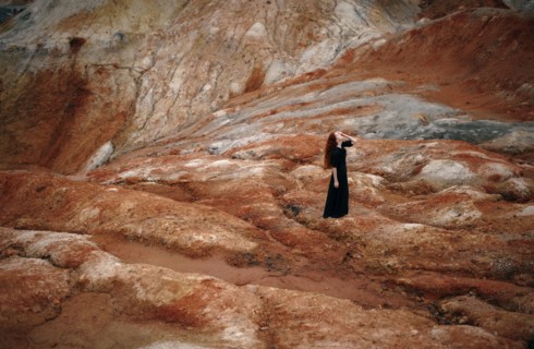 Caucasian woman walking on rock formation