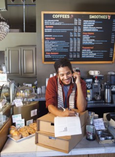 Mixed race man working in coffee shop