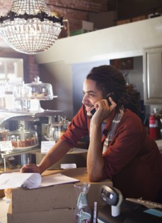 Mixed race man working in coffee shop