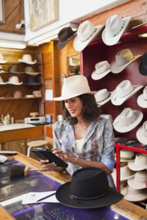 Ecuadorian woman working in hat store