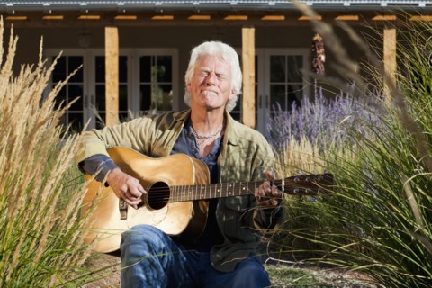 Caucasian man playing guitar
