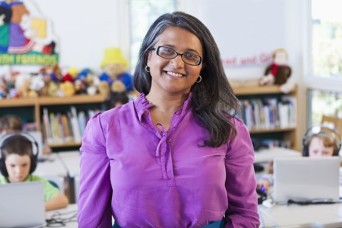 Indian teacher standing in classroom