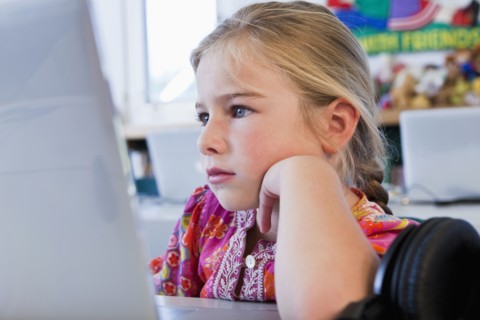 Caucasian girl using computer