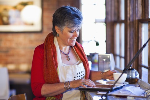 Caucasian woman working in coffee shop