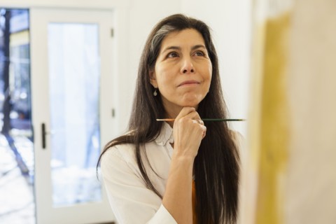 Hispanic artist working in studio