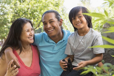Family smiling outdoors
