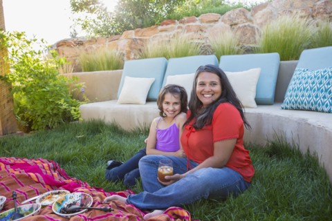 Mother and daughter eating outdoors