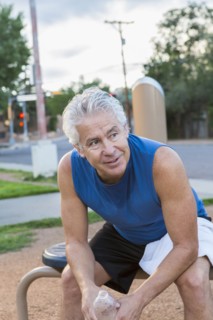 Hispanic man resting in park