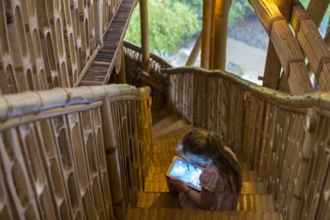 Caucasian girl using digital tablet on steps
