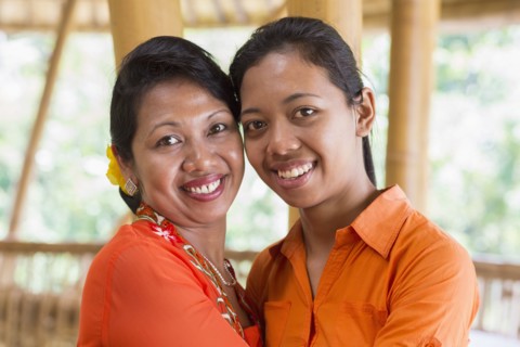 Balinese mother and daughter hugging