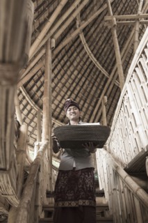 Balinese man carrying basket in hotel
