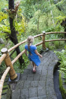 Caucasian girl descending stone steps
