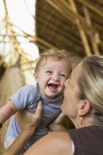 Caucasian mother playing with baby boy