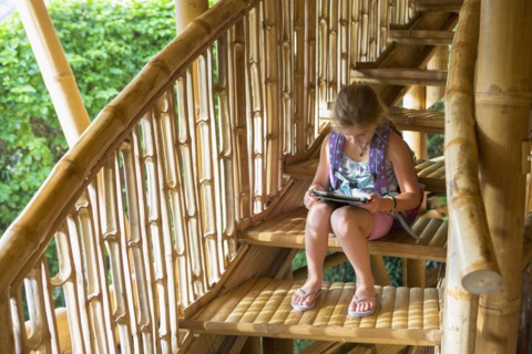 Caucasian girl reading on steps