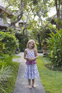 Caucasian girl smiling on stone walkway
