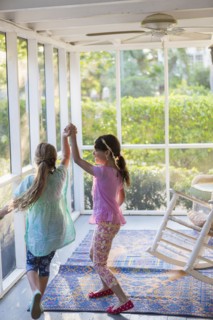 Girls playing together on porch