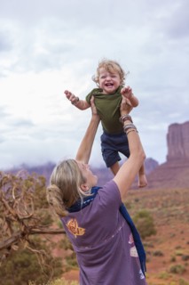 Caucasian mother and son playing in desert