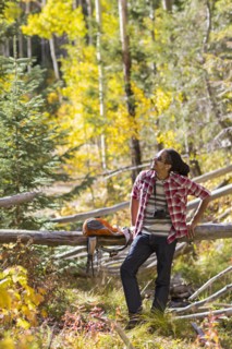 Mixed race man hiking in forest