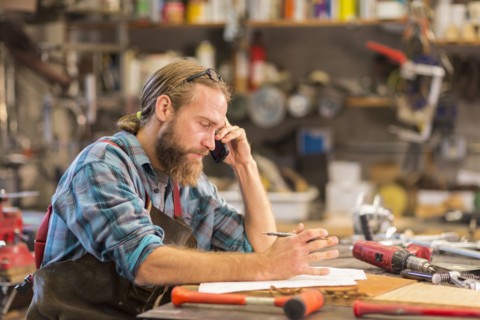 Caucasian craftsman working in workshop