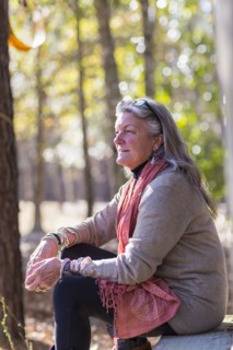 Older Caucasian woman sitting outdoors