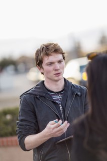 Canvasser talking to woman in city