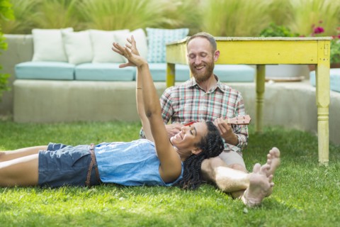 Couple relaxing in backyard