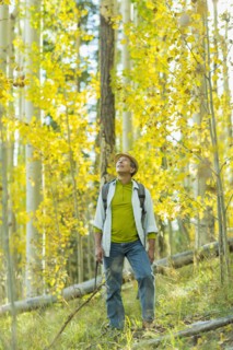 Man exploring autumn forest