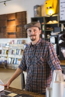 Caucasian barista working in cafe
