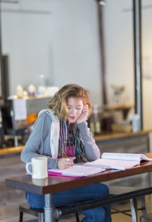 Mixed race student studying at table