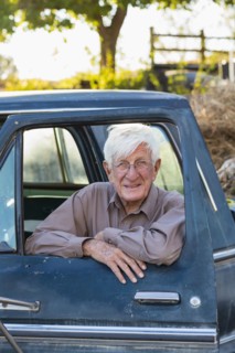 Older Caucasian man sitting in truck